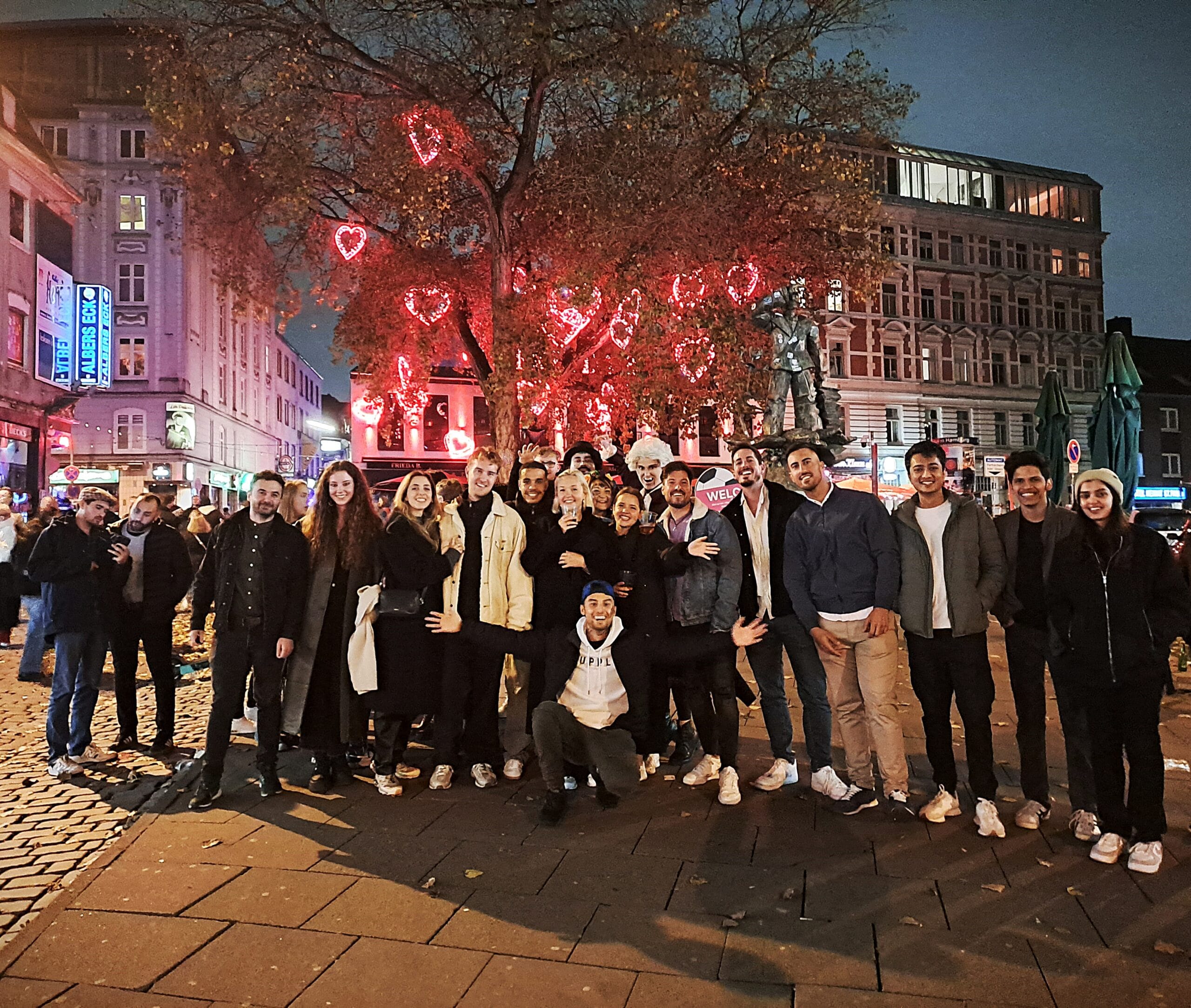 Large pubcrawl party group outside a Berlin nightclub during a pub crawl, waiting for VIP club entry