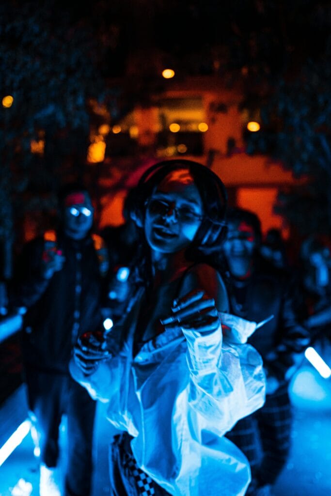 Party guest dancing at a Berlin pub crawl, enjoying music and drinks in the nightlife tour
